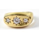A 9ct yellow gold dress ring set with three white stones in starburst setting, size K, approx 3g.