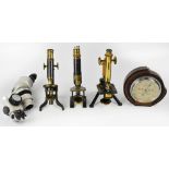 Three brass monocular microscopes including one by W Watson & Sons of 313 High Holborn London,
