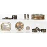 A collection of hallmarked silver items to include napkin rings, small trays, etc,