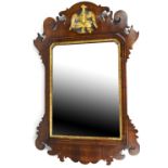 A 19th century mahogany fretwork framed wall mirror with gilded Hoho bird within scrolling mounts