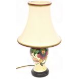 MOORCOFT; an 'Anna Lily' pattern pottery lamp with tube lined decoration,