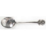 An Arts & Crafts hammered silver spoon,