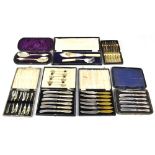 A quantity of cased plated flatware to include a set of six silver pistol-handled dessert knives,