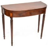 A 19th century mahogany fold-over tea table to tapering supports and peg feet,