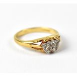 An 18ct yellow gold ladies' dress ring set with two diamonds in heart-shaped platinum setting,