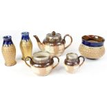 ROYAL DOULTON; a Doulton Lambeth salt glazed three-piece silver mounted tea set comprising teapot,