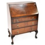 An early 20th century mahogany bureau with drop-down desktop,