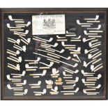 EDWARD POLLOCK, MANCHESTER; a glazed display of clay pipes from the Edward Pollock Clay Pipe Works,