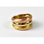 A yellow and rose metal triple band ring, two bands brushed gold, approx 3.5g.