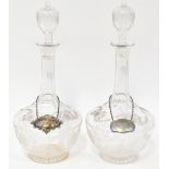 A pair of 19th century decanters with etched floral and leaf decoration,