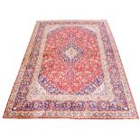 A fine hand knotted Persian wool Mashad carpet,