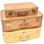 Three vintage leather suitcases to include an Innovation solid square, possibly pigskin,