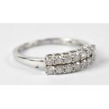 A 10ct white gold ring set with two rows of tiny diamonds, size L, approx 1.7g.