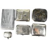 Two hallmarked silver cigarette cases with chased decoration, a hallmarked silver vesta case,
