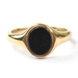 A gentlemen's 9ct gold signet ring set with a flush goldstone panel, size P, approx 4g.