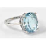 A silver ring set with pale blue topaz, size L.