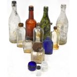 A collection of vintage glass bottles to include a green glass bottle stamped 'Fowler of Preston',