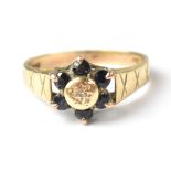 A vintage 9ct gold diamond and sapphire cluster ring,