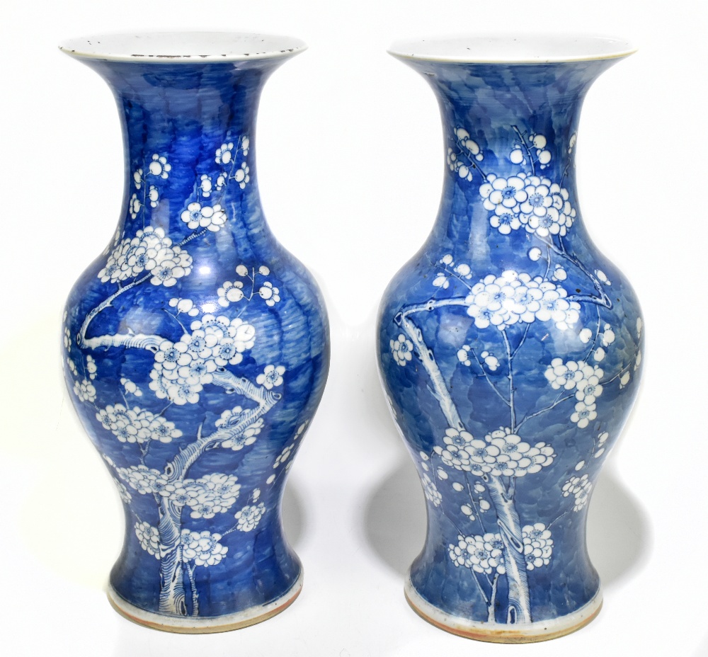 A near pair of 19th century Chinese blue and white porcelain vases decorated with prunus flowers