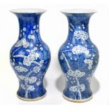 A near pair of 19th century Chinese blue and white porcelain vases decorated with prunus flowers