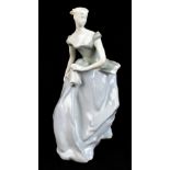 A circa 1950s Lomonosov (USSR) figure representing a lady wearing a flowing evening dress, stamped