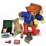 A post war German blonde plush teddy bear, with glass eyes, length 40cm, with a Paddington Bear with