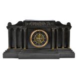 A 19th century black slate eight day mantel clock, of architectural form with visible escapement and