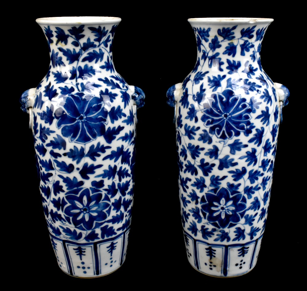 A pair of 19th century Chinese blue and white porcelain vases each with moulded handles representing