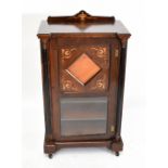 A Victorian inlaid walnut and faux grained walnut music cabinet, the panelled door with a bevelled