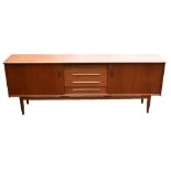 TROEDS BJARNUM; a Swedish teak sideboard with four central short drawers flanked by sliding doors,