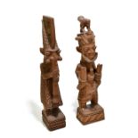 JOSEPH ADEYEMI FAKEYE (NIGERIAN, born 1931); a west African carved wood figure, modelled playing a