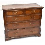 A George III oak and mahogany inlaid chest, with two short and three graduated long drawers, on