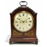 An early 19th century mahogany bracket clock with brass carry handle, eight day fusee movement, with