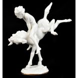 K. TUTTER FOR HUTSCHENREUTHER; a Blanc-de-Chine figure representing a child riding a prancing