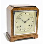 ELLIOTT; an Art Deco walnut eight day mantel clock with silvered Roman numeral dial and movement