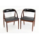 ORTE MOBELFABRIK; a pair of Danish teak framed armchairs, with black vinyl backs and seat