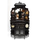 A Victorian carved mahogany mirror back dresser, the raised back with five shaped and bevelled
