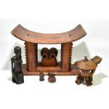 A 20th century tribal art Ashanti stool, the central carved decoration with a dished seat, height