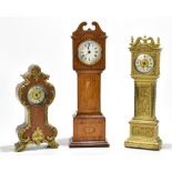 An early 20th century gilt brass mantel clock modelled as a longcase clock, the Arabic numeral