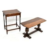 A reproduction oak refectory type coffee table, raised on carved acorn supports, width 88cm,