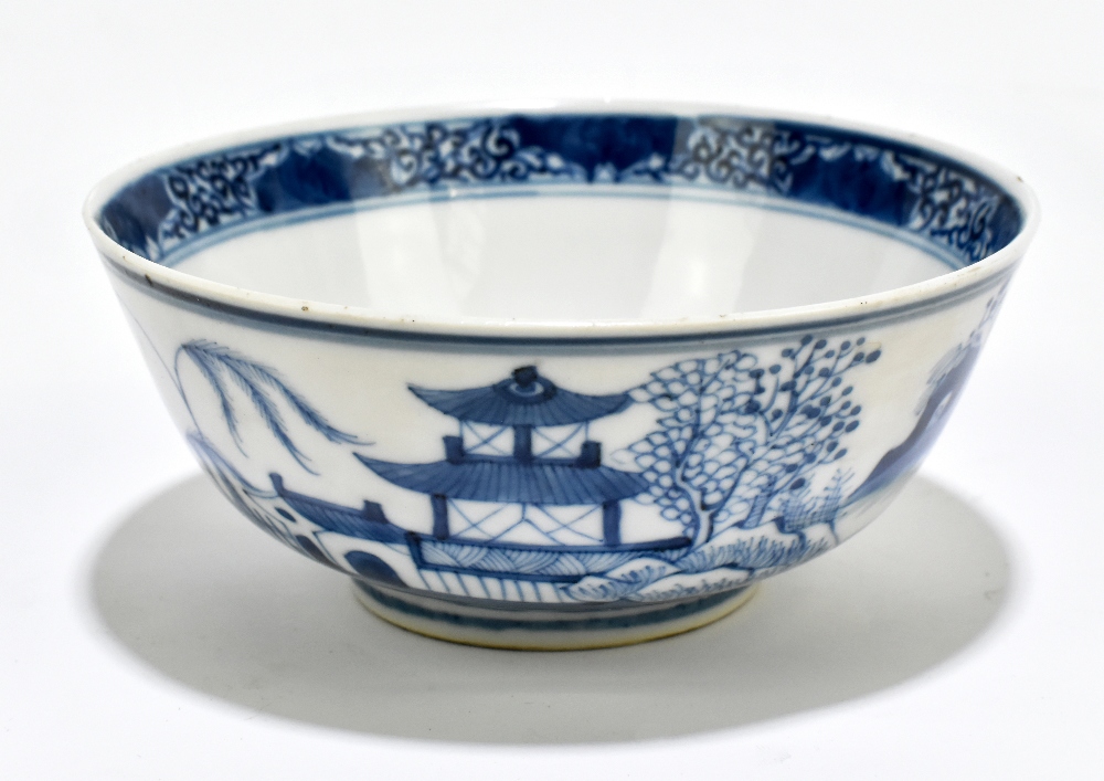 A 19th century Chinese blue and white porcelain footed bowl decorated with objects to the interior