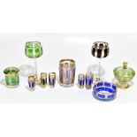 A collection of late 19th century Bohemian flashed glassware including a pair of two hock glasses,