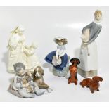 LLADRO; three figures including a girl cradling a lamb, height 29cm and two Beswick dachshunds and a