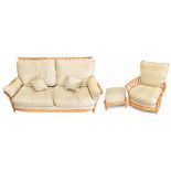 ERCOL; a Renaissance light elm two piece lounge suite comprising of sofa, armchair and matching