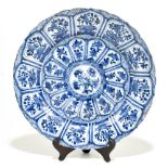 An 18th century Chinese Export blue and white porcelain wall charger with central stylised floral