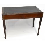 A late 19th century mahogany writing table, the tooled leather inset top above a frieze drawer