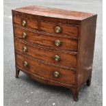 A 19th century mahogany bow fronted chest of two short over three long drawers, with ebonised inlay,