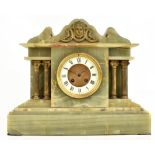 A Victorian onyx mantel clock of architectural from with applied gilt metal mask head decoration