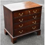 A George III mahogany secrétaire chest of four drawers, the top drawer with pull-down front