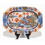 An 18th century Chinese clobbered blue and white octagonal dish, decorated with a harbour scene,